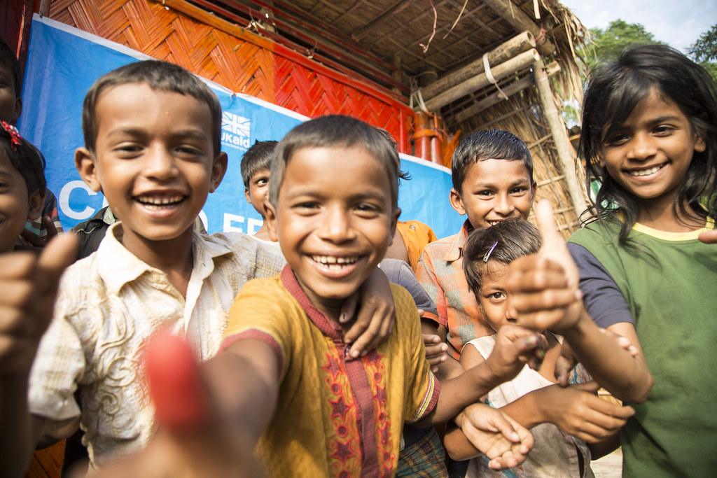 "Rohingya children playing at a UNICEF child friendly space, supported by UK aid, inside Batukhali refugee camp in Bangladesh" by DFID - UK Department for International Development is licensed under CC BY 2.0